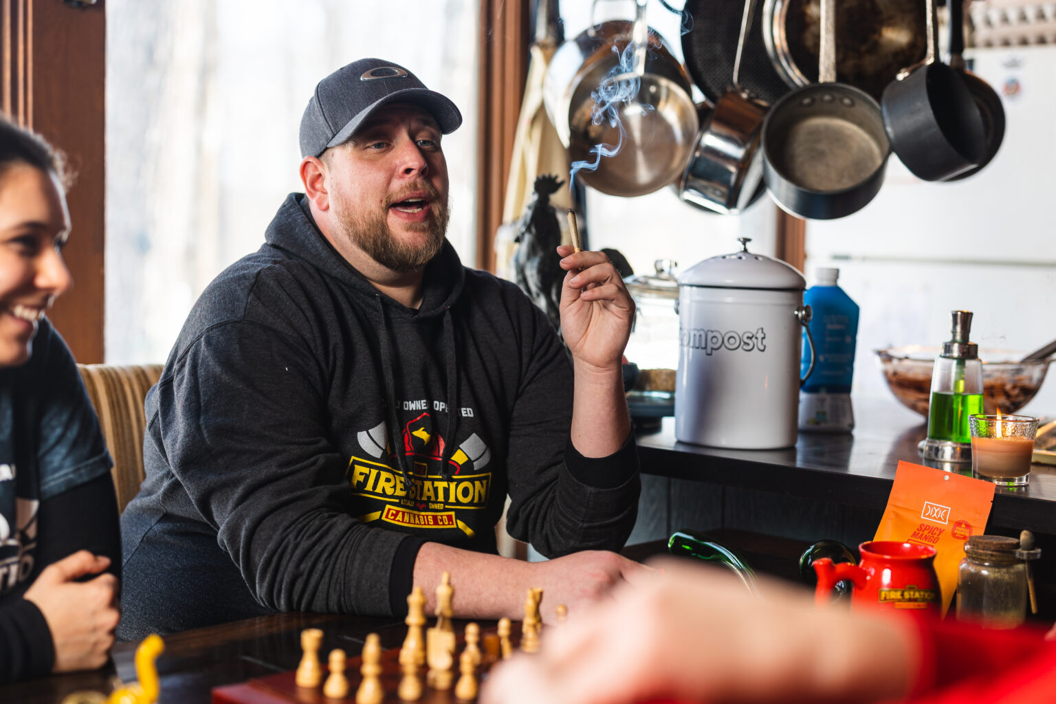 Man smoking a joint while playing chess